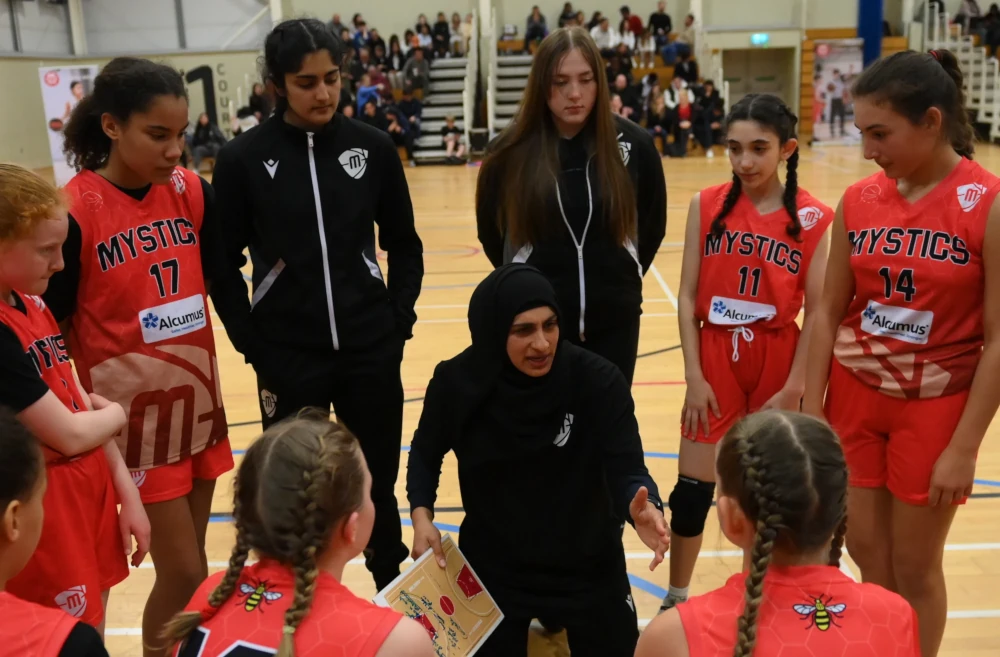 coach-with-players.webp